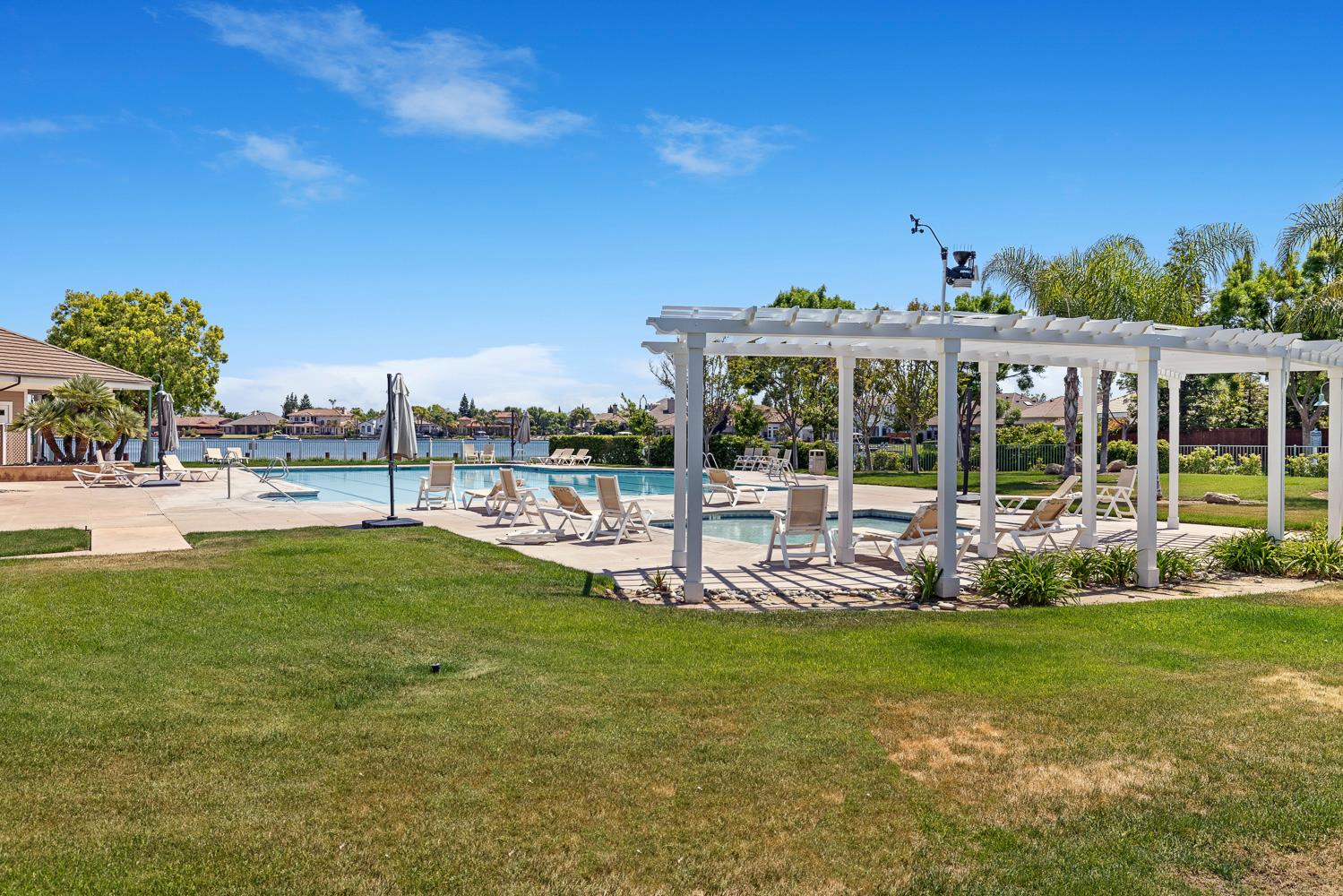 4674 North Arrow Ridge Way Clovis, CA 93619 - Photo 63 of 77 a view of a house with a yard porch and sitting area