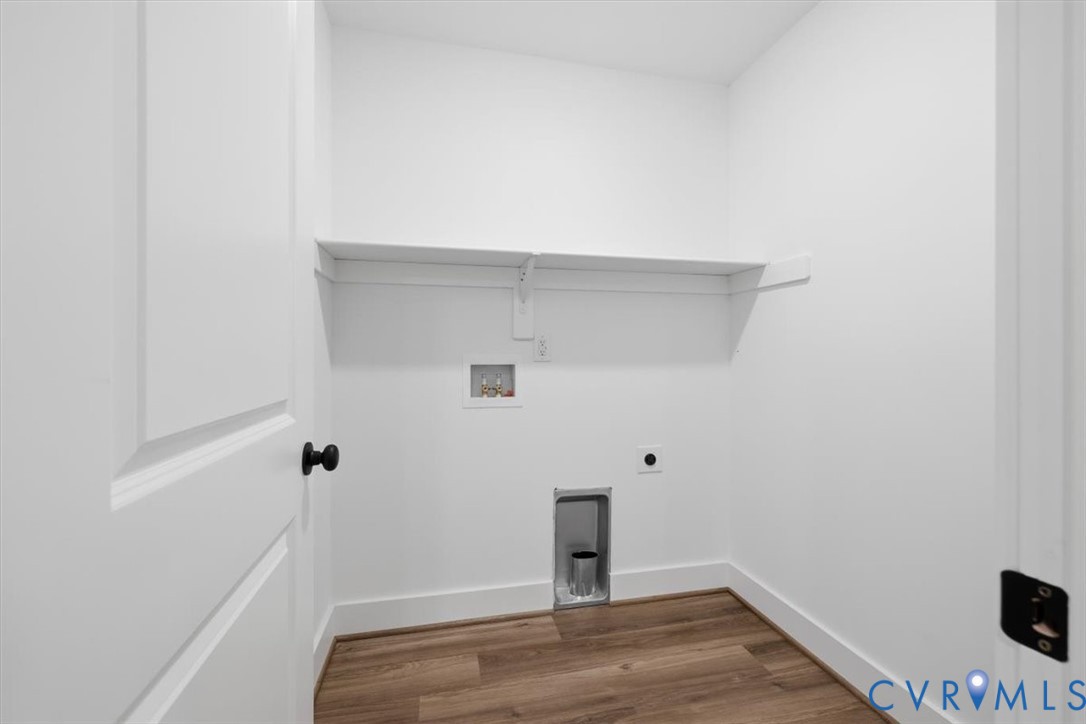 654 Frenchs Store Road Cumberland, VA 23040 - Photo 8 of 24 Laundry area featuring wood-finish flooring, white