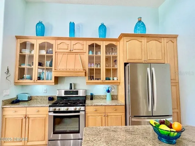 a bathroom with a granite countertop sink a mirror and a shower