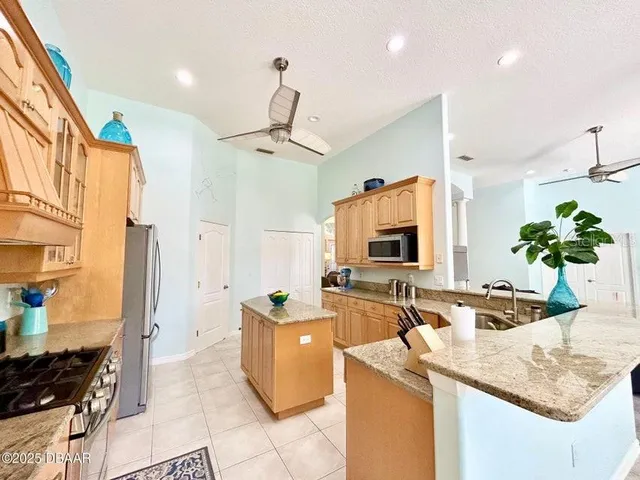 a view of a dining room with furniture and a large window