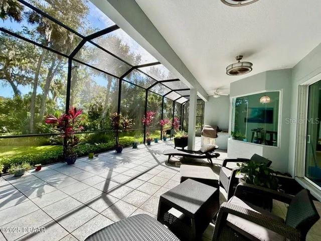 a view of swimming pool with seating area