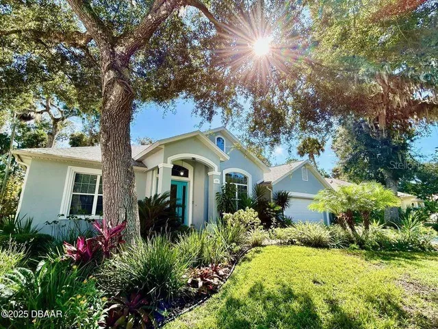 a view of a backyard of the house