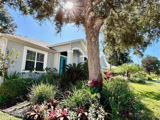 a street sign that is sitting on a bench in front of house
