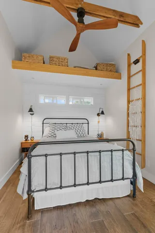 a living room with hard wood floor and furniture