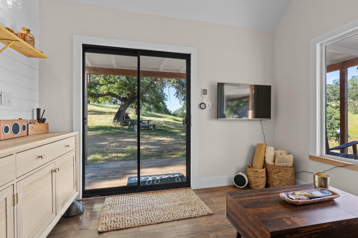 14883 Vaira Ranch Road Drytown, CA 95699 - Photo 24 of 60 a living room with hard wood floor and furniture