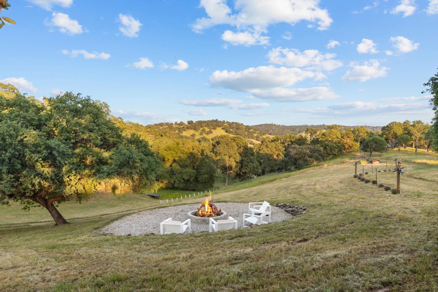 14883 Vaira Ranch Road Drytown, CA 95699 - Photo 4 of 60 a view of a lake with mountains in the background