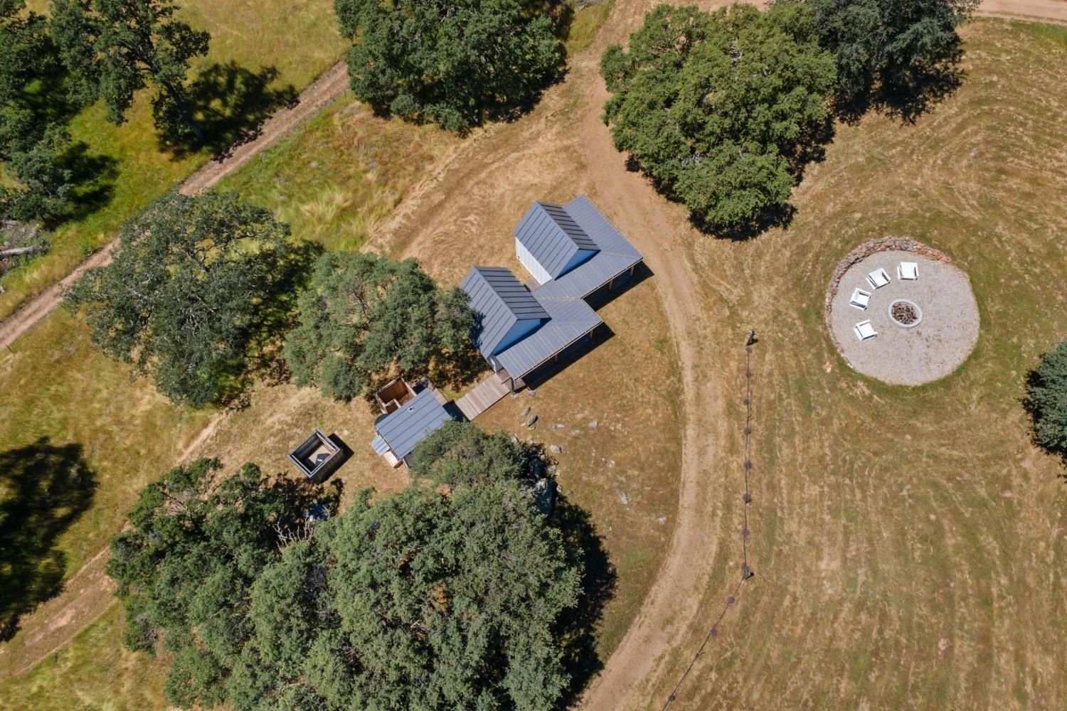 14883 Vaira Ranch Road Drytown, CA 95699 - Photo 49 of 60 an aerial view of a house with garden space and sitting space