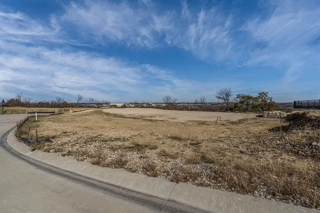 a view of a lake with houses in the back