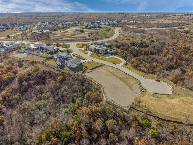 an aerial view of a residential houses with outdoor space