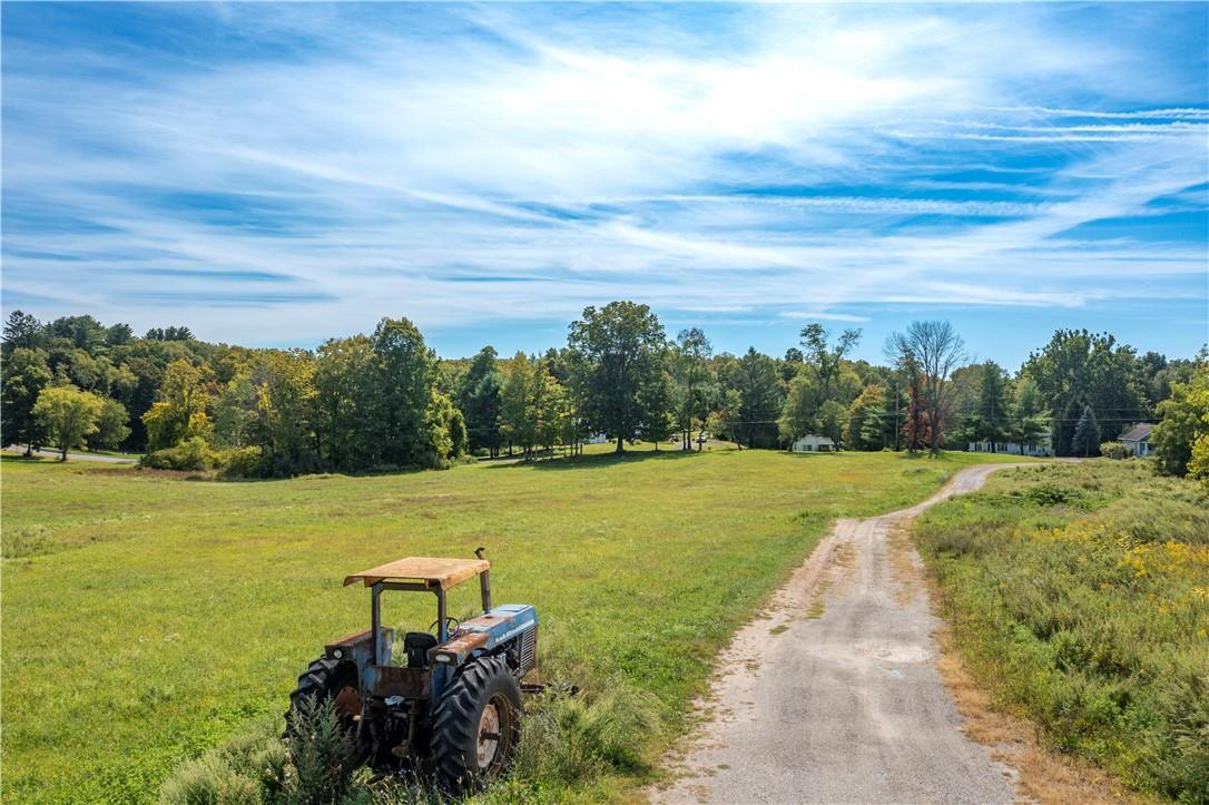 57 Quaker Hill Road Pawling, NY 12564 - Photo 17 of 20 a view of a lake with a big yard