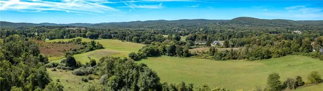 a view of a lake with mountains in the background