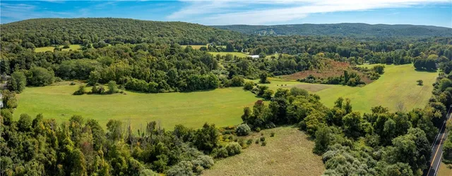 a view of a city with mountains in the background