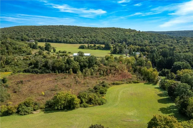 a view of an ocean from a mountain