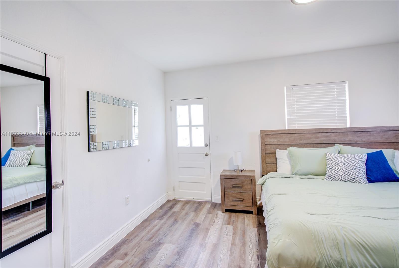 855 Southwest 7th Street Miami, FL 33130 - Photo 16 of 59 a bedroom with a bed and a window