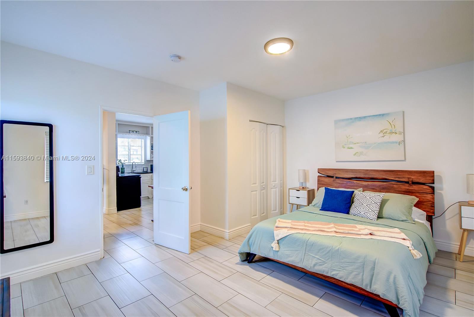 855 Southwest 7th Street Miami, FL 33130 - Photo 20 of 59 a bedroom with a large bed and walk in closet