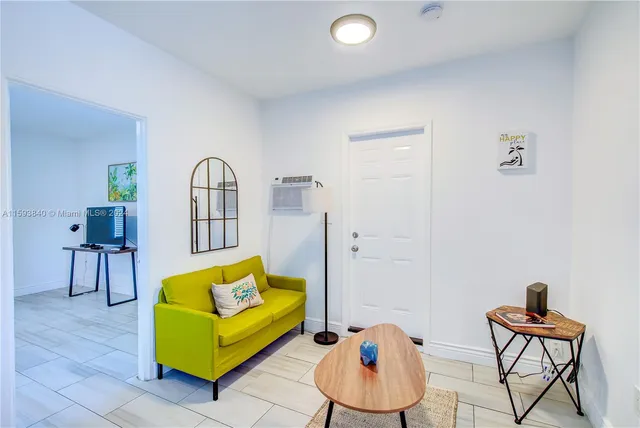 a kitchen with a refrigerator and a sink