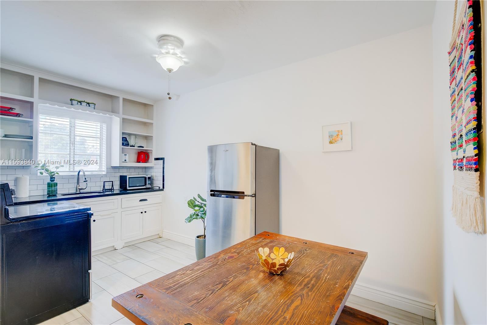 855 Southwest 7th Street Miami, FL 33130 - Photo 25 of 59 a kitchen with a wooden floor and cabinets