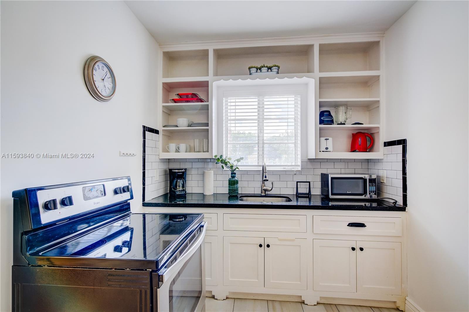 855 Southwest 7th Street Miami, FL 33130 - Photo 27 of 59 a kitchen with cabinets and window