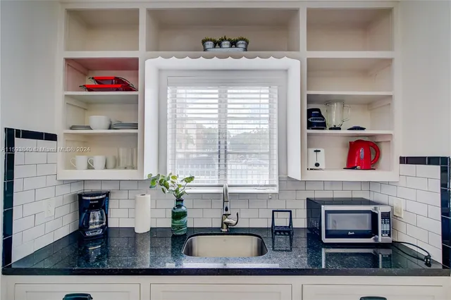 a bedroom with a bed and a table in it