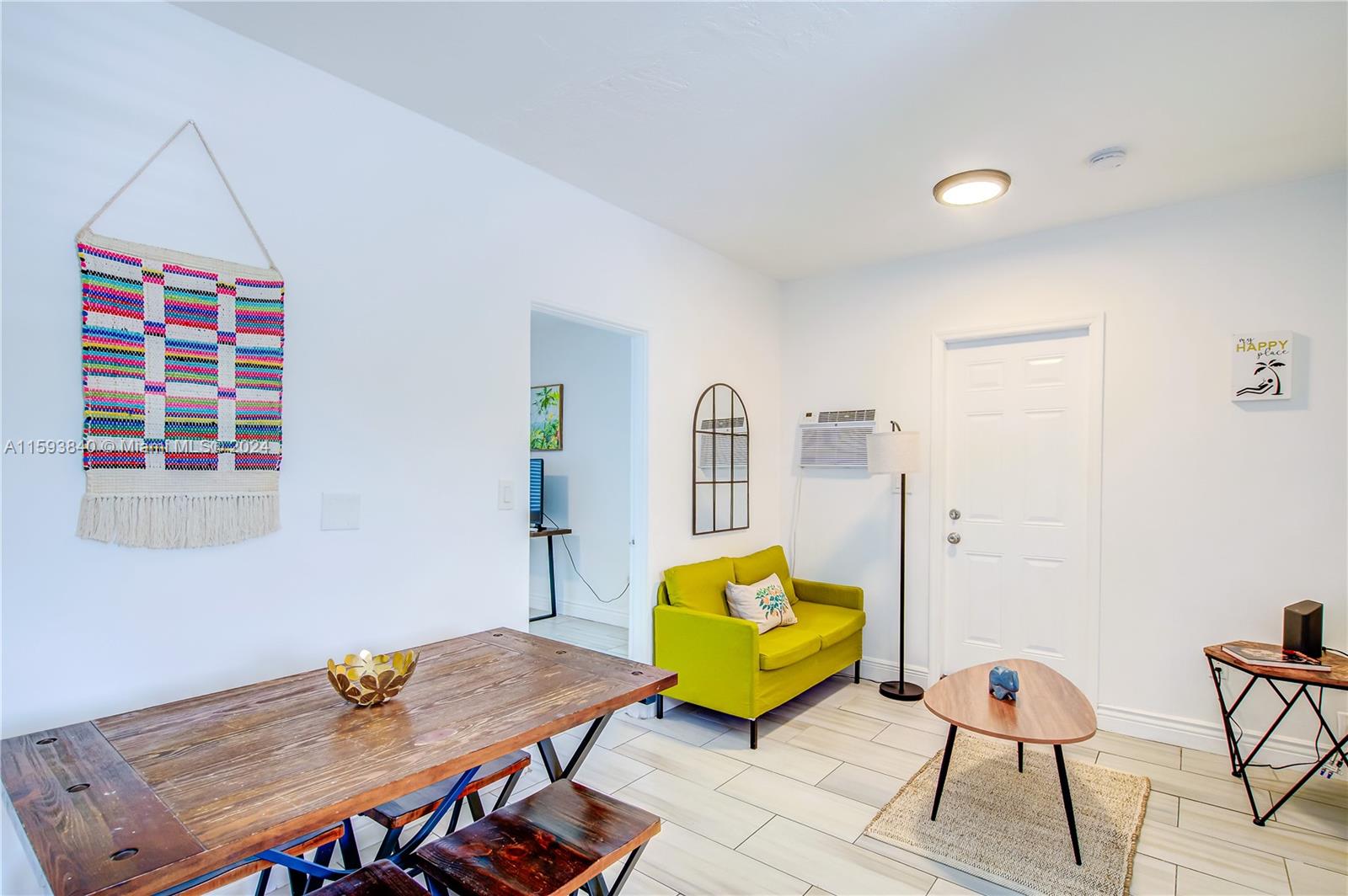 855 Southwest 7th Street Miami, FL 33130 - Photo 29 of 59 a living room with furniture and wooden floor