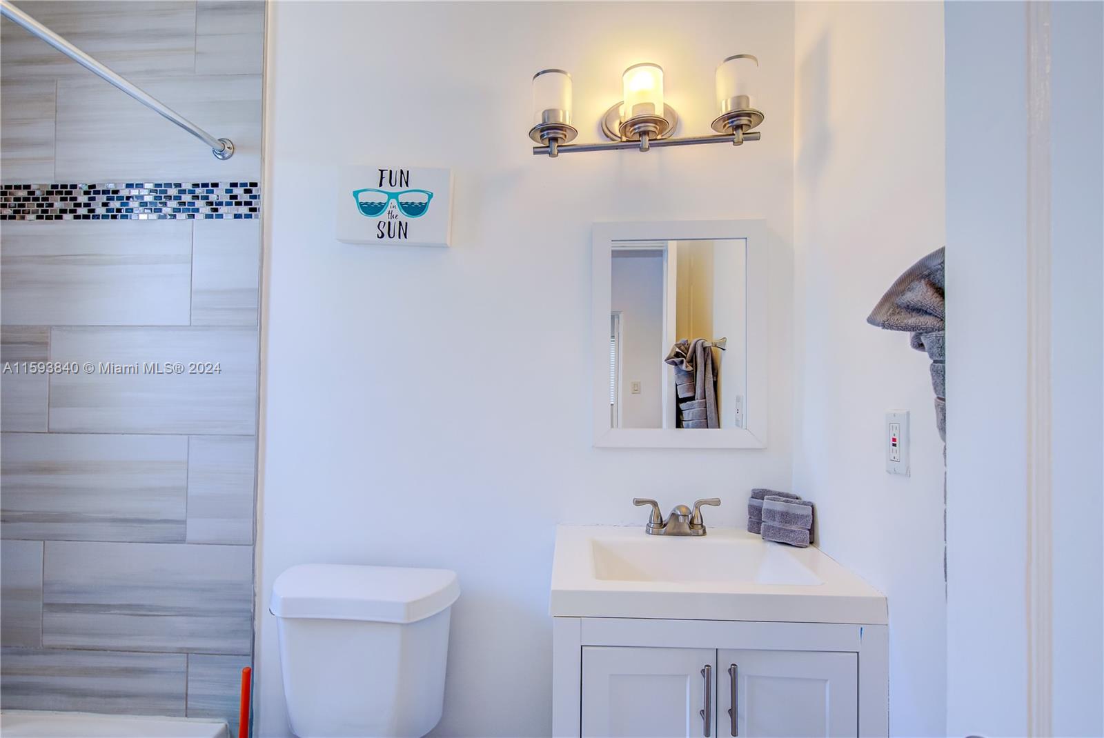 855 Southwest 7th Street Miami, FL 33130 - Photo 30 of 59 a bathroom with a sink a toilet and mirror