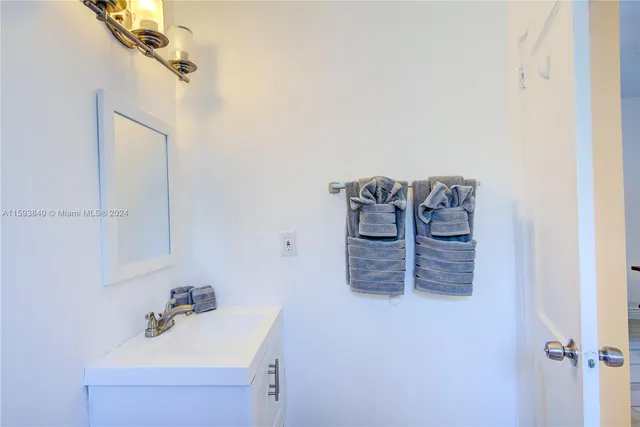 a view of a room with wooden floor and furniture