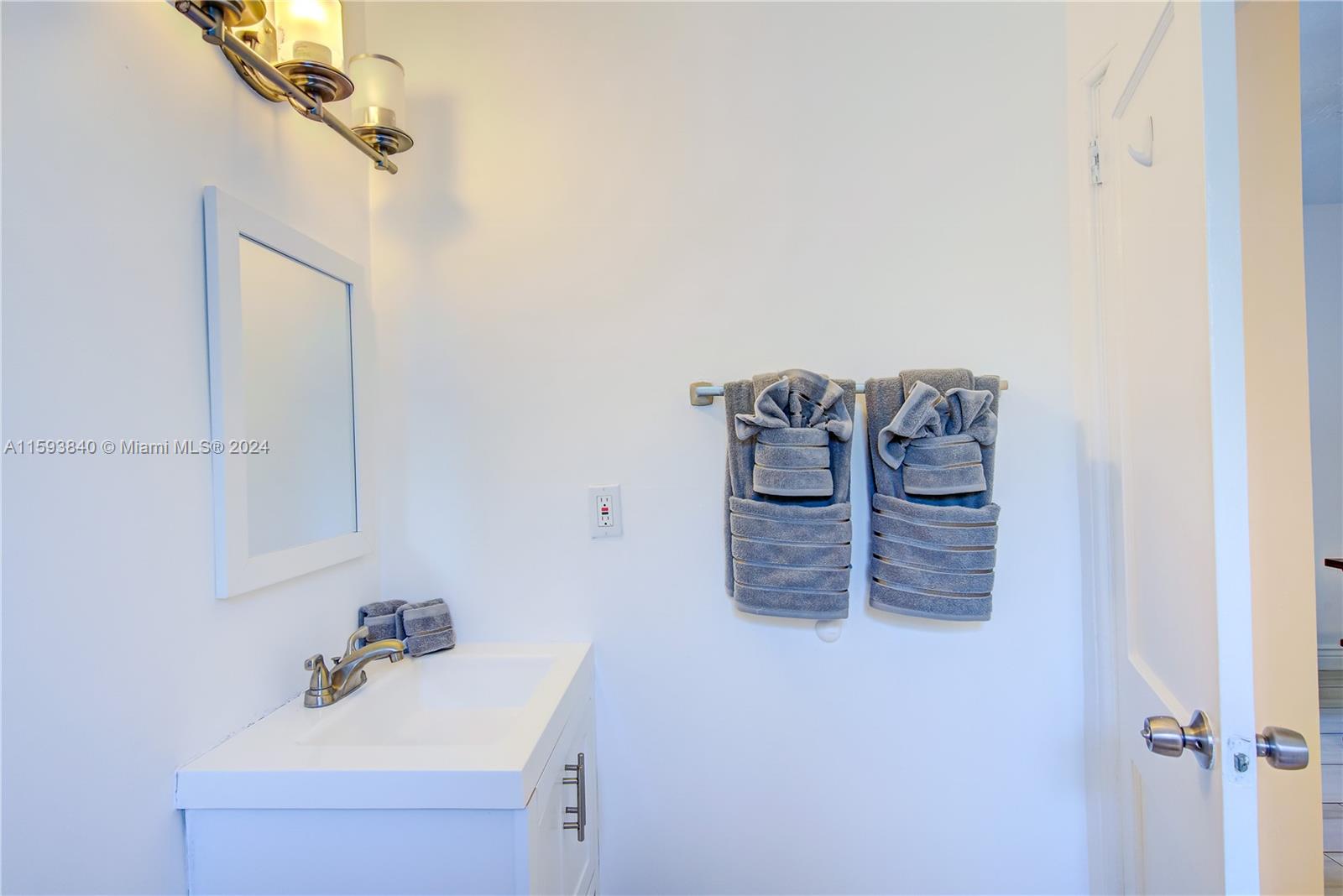 855 Southwest 7th Street Miami, FL 33130 - Photo 32 of 59 a bathroom with a sink and mirror