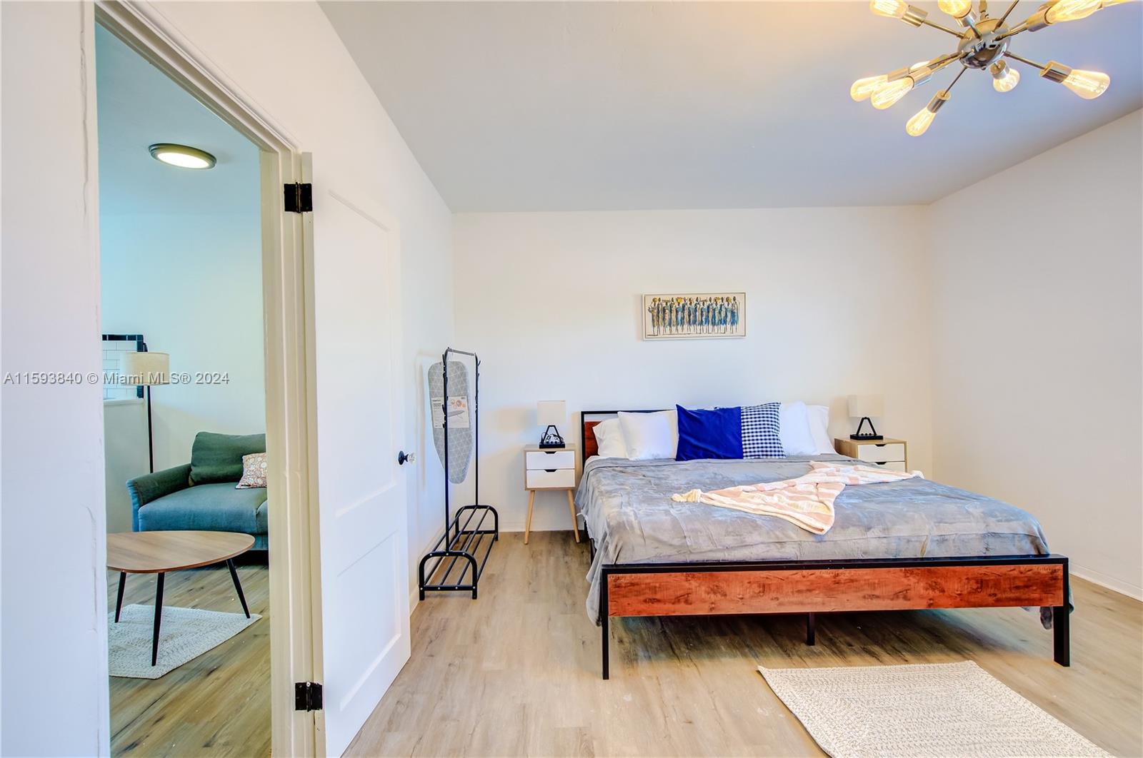 855 Southwest 7th Street Miami, FL 33130 - Photo 34 of 59 a bedroom with a bed and a table in it