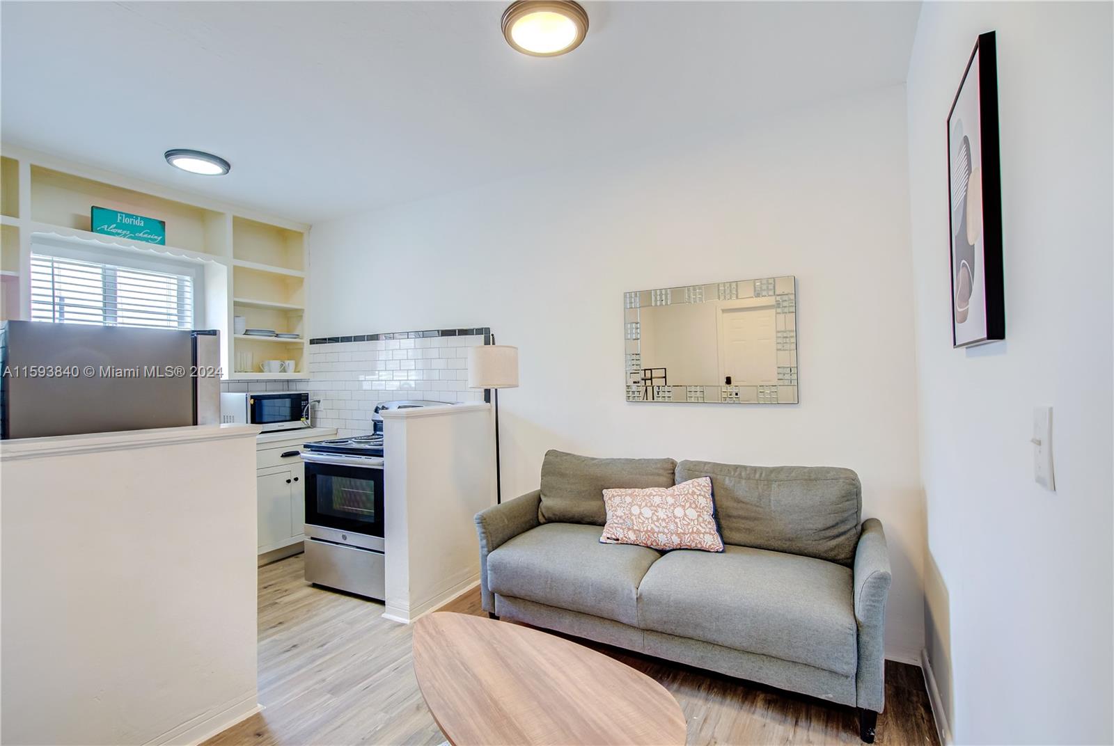 855 Southwest 7th Street Miami, FL 33130 - Photo 36 of 59 a living room with furniture and a fireplace