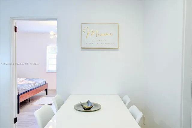 a kitchen with a refrigerator and a stove