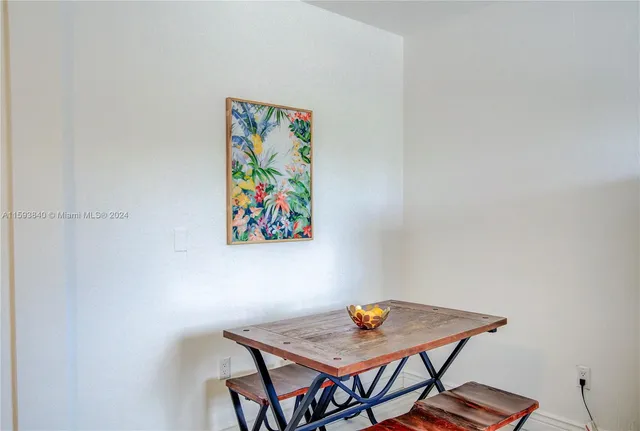 a bathroom with a toilet sink vanity tub and mirror