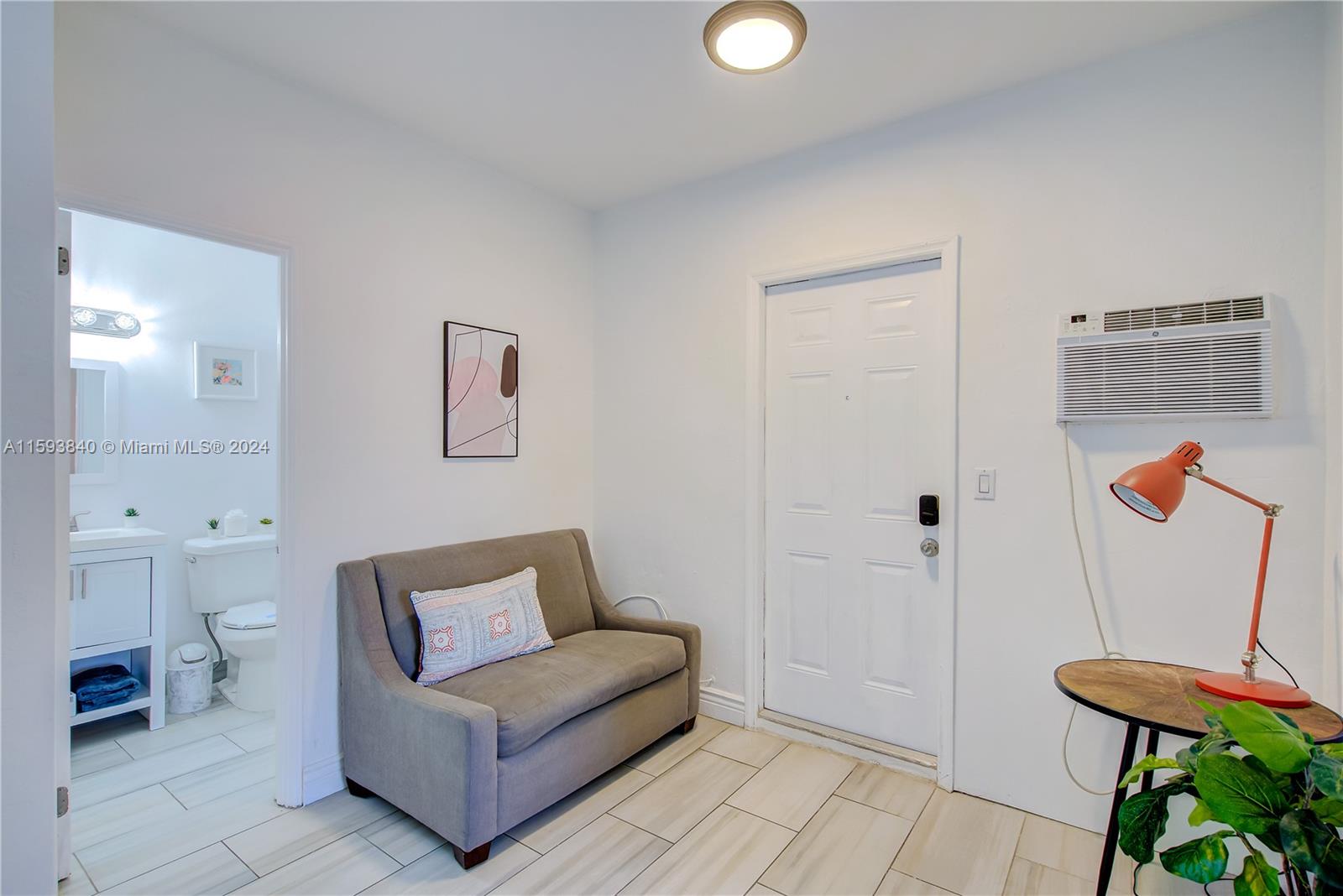 855 Southwest 7th Street Miami, FL 33130 - Photo 51 of 59 a living room with furniture and a wooden floor