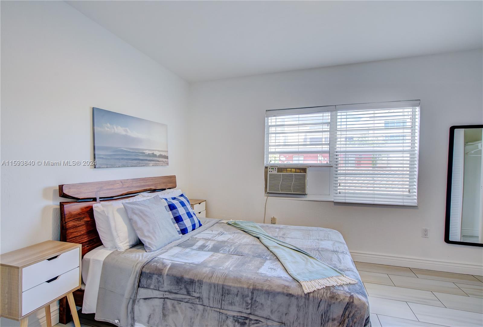 855 Southwest 7th Street Miami, FL 33130 - Photo 56 of 59 a bedroom with a bed and window