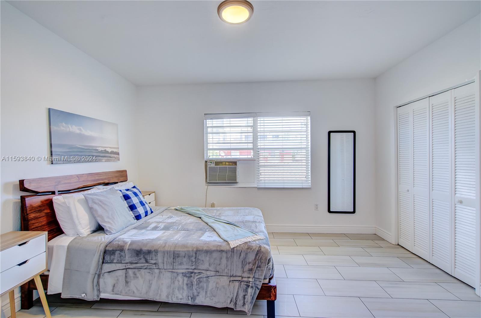 855 Southwest 7th Street Miami, FL 33130 - Photo 57 of 59 a bedroom with a bed and a window