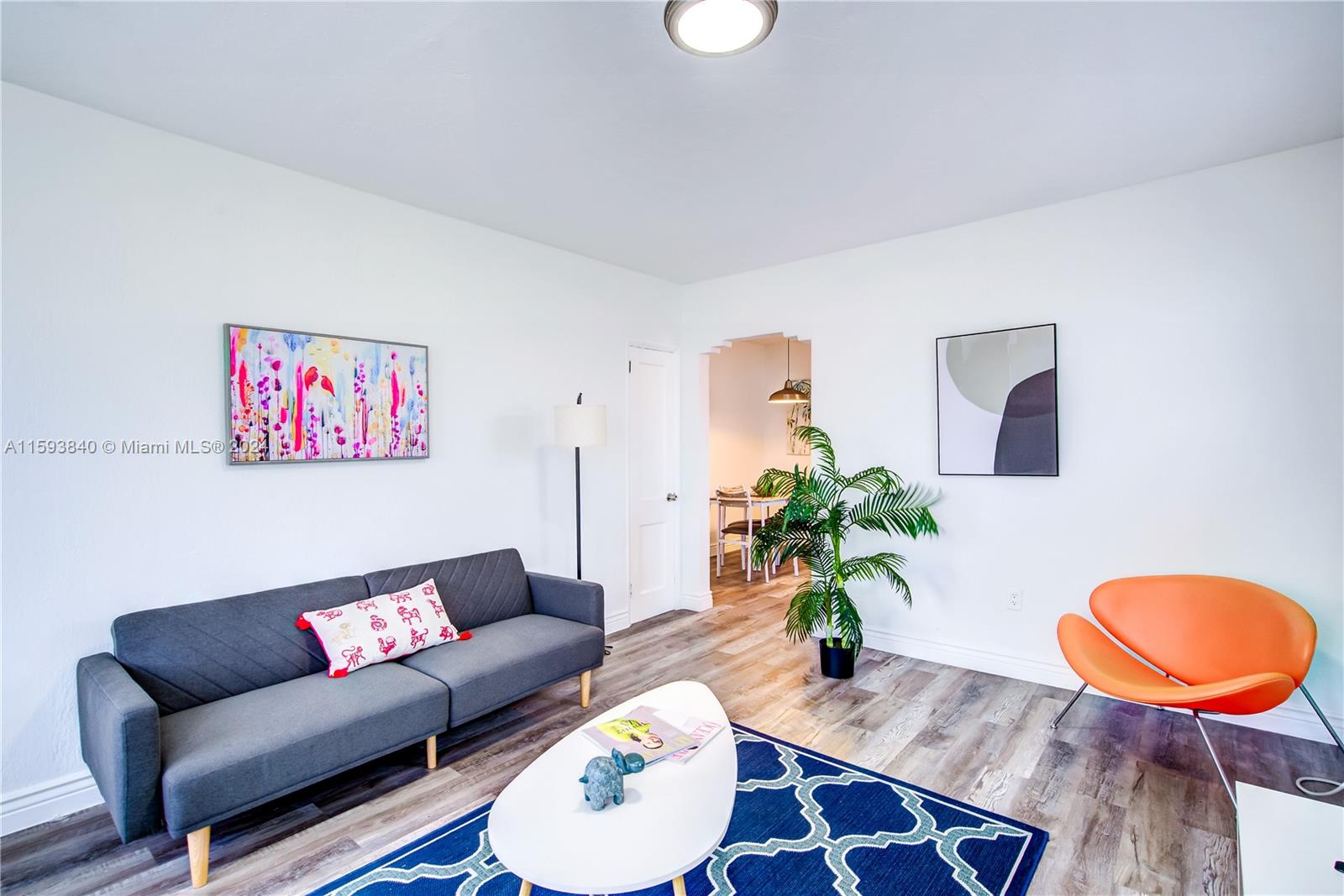855 Southwest 7th Street Miami, FL 33130 - Photo 6 of 59 a living room with furniture potted plant and a lamp