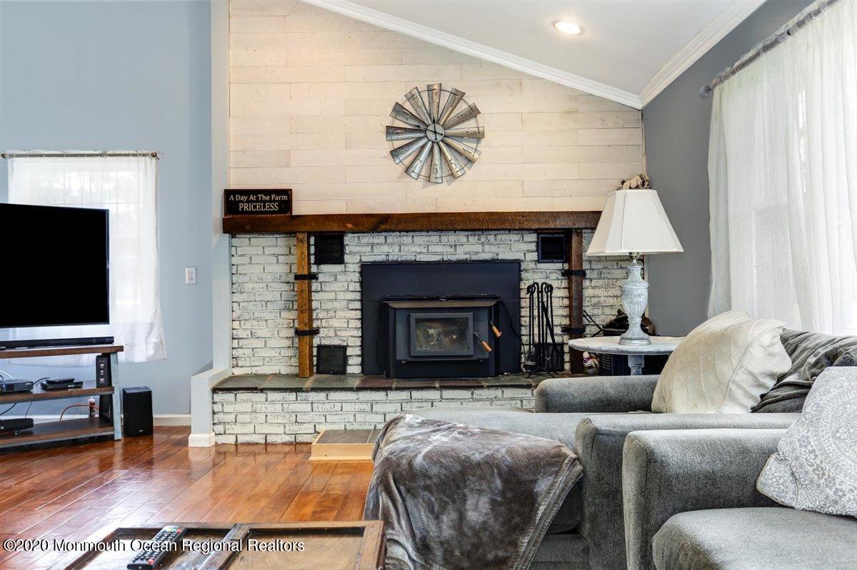 58 Ridge Road Branchville, NJ 07826 - Photo 13 of 51 a living room with furniture and a fireplace