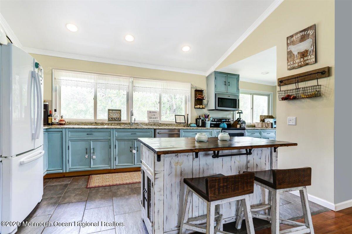 58 Ridge Road Branchville, NJ 07826 - Photo 15 of 51 a kitchen with stainless steel appliances granite countertop a sink and a refrigerator