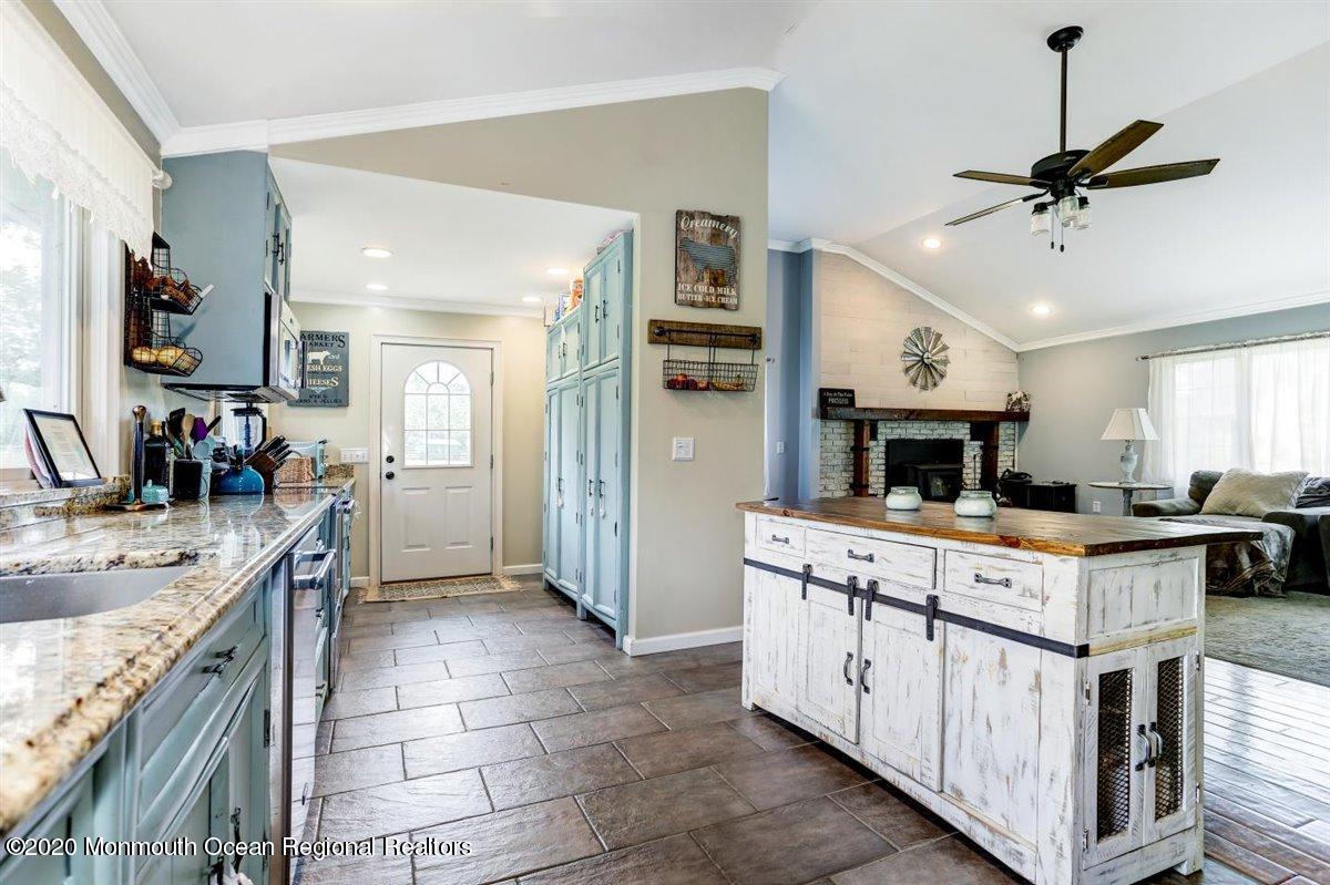 58 Ridge Road Branchville, NJ 07826 - Photo 17 of 51 a kitchen with kitchen island granite countertop a sink counter top space appliances and a center island