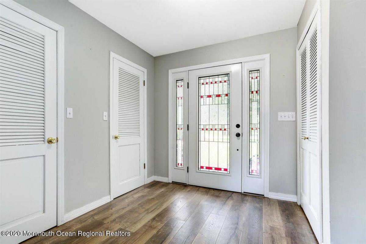 58 Ridge Road Branchville, NJ 07826 - Photo 3 of 51 a view of an empty room with wooden floor and a window