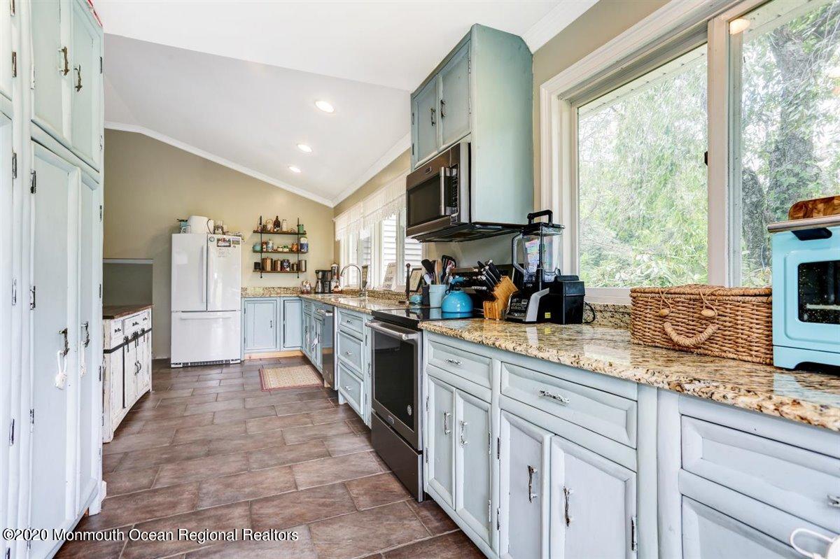 58 Ridge Road Branchville, NJ 07826 - Photo 21 of 51 a large kitchen with a large window and stainless steel appliances