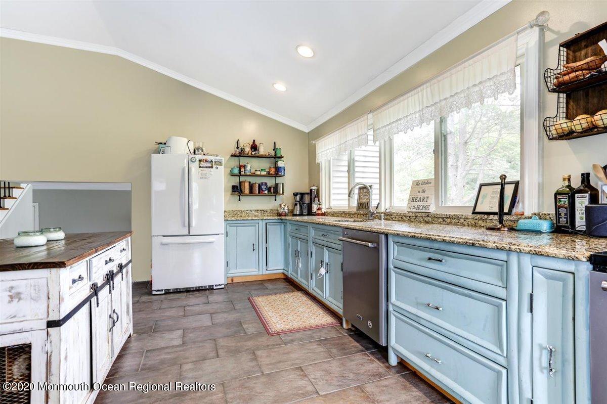 58 Ridge Road Branchville, NJ 07826 - Photo 22 of 51 a kitchen with stainless steel appliances granite countertop a stove a sink and a refrigerator