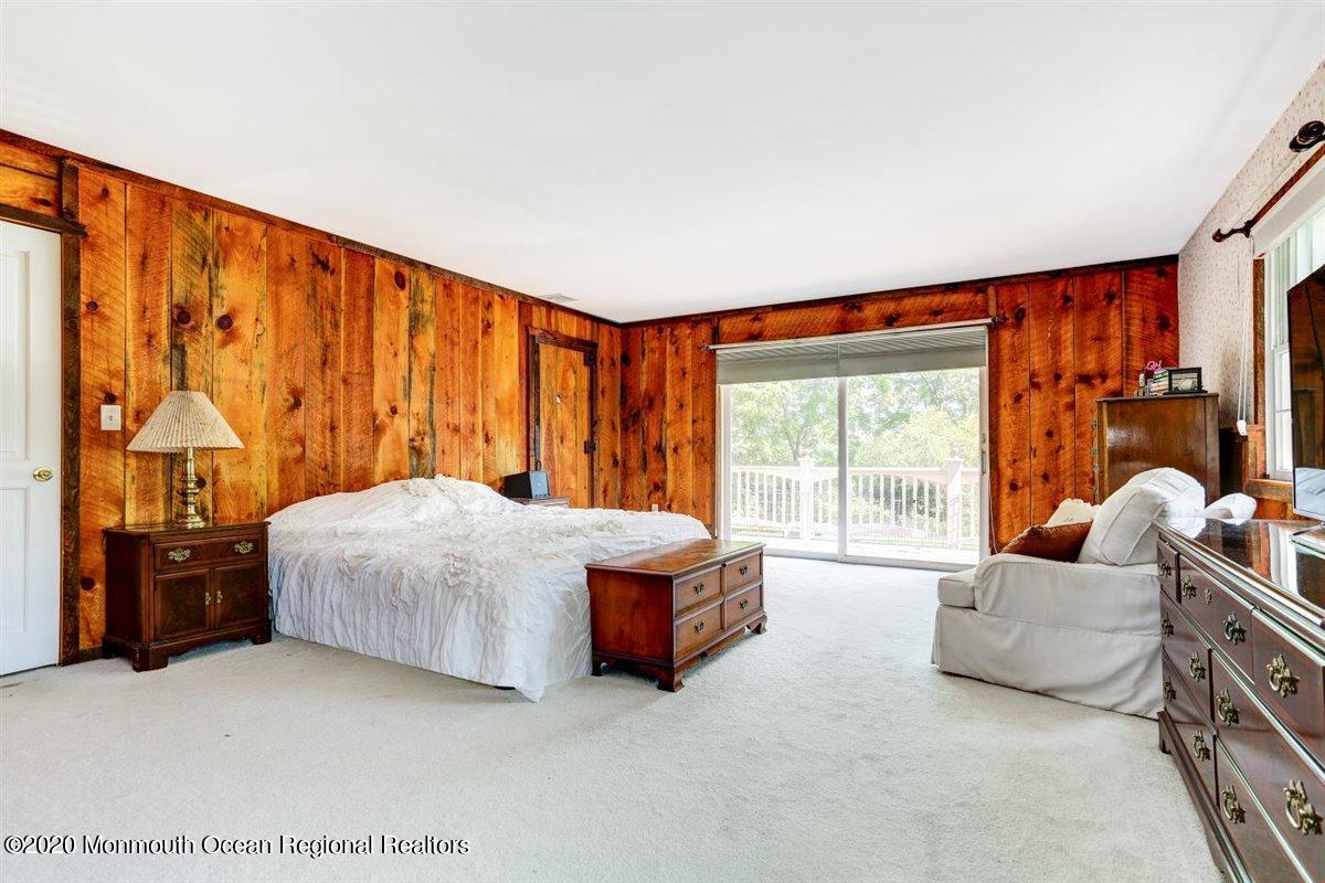 58 Ridge Road Branchville, NJ 07826 - Photo 25 of 51 a spacious bedroom with a bed and glass window