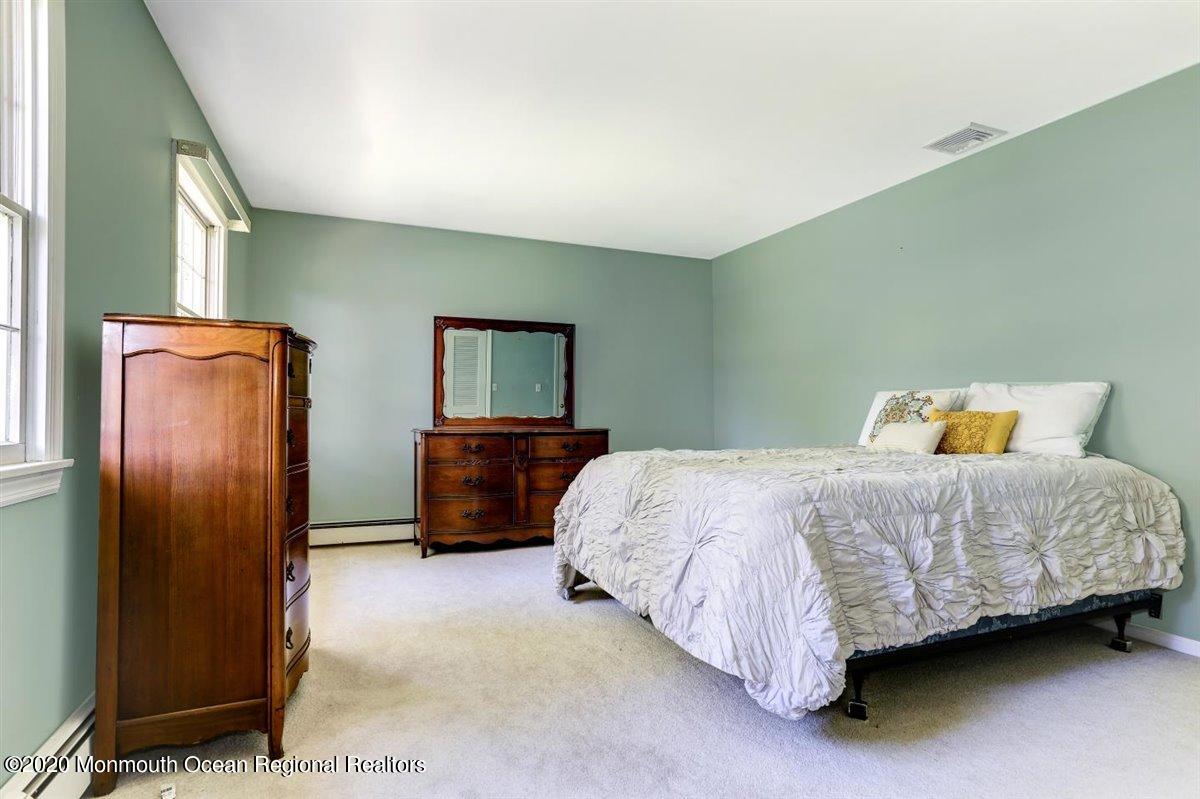58 Ridge Road Branchville, NJ 07826 - Photo 28 of 51 a bedroom with a bed dresser and a flat screen tv