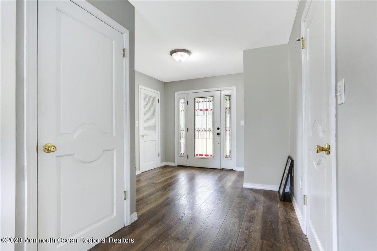 58 Ridge Road Branchville, NJ 07826 - Photo 4 of 51 a view of an empty room with wooden floor and a window