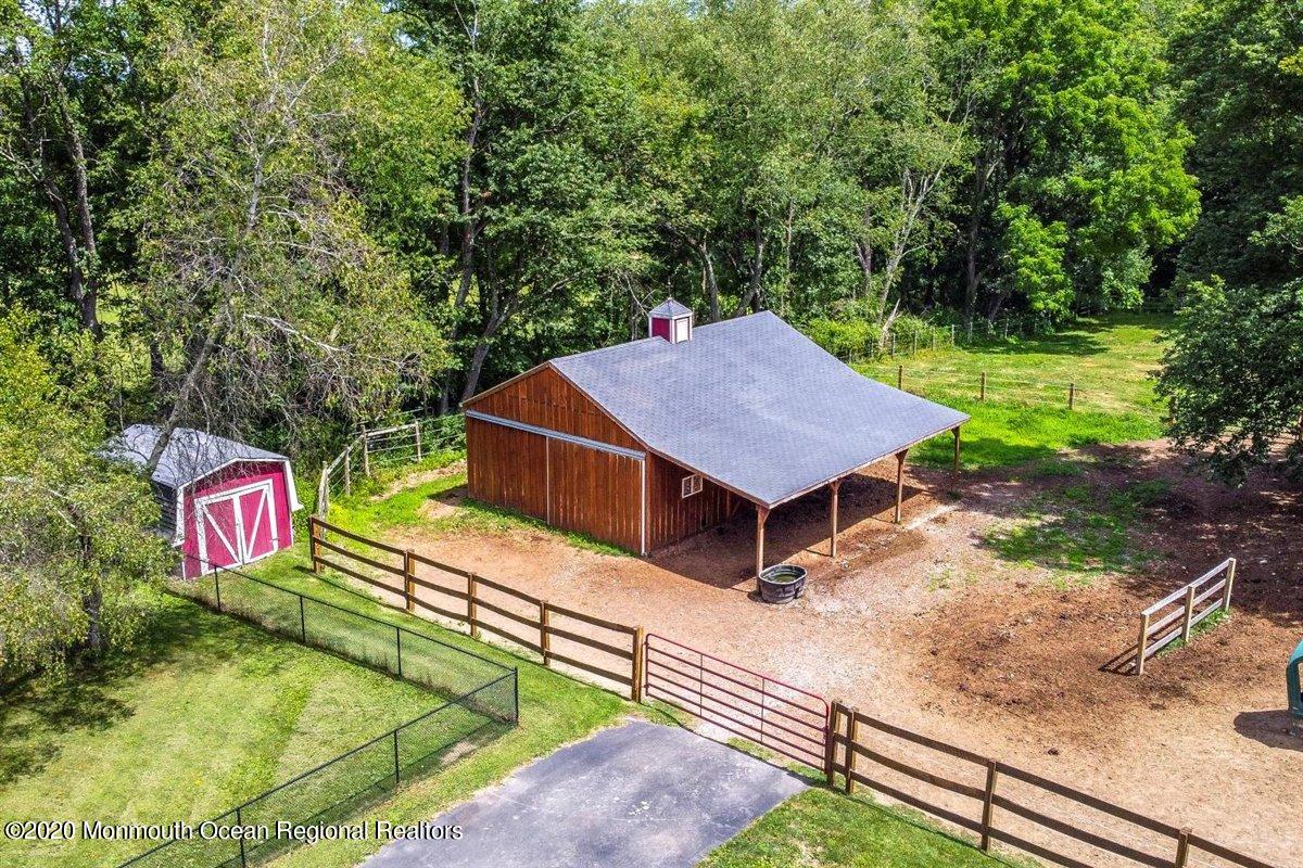 58 Ridge Road Branchville, NJ 07826 - Photo 44 of 51 a view of a wooden house with a yard