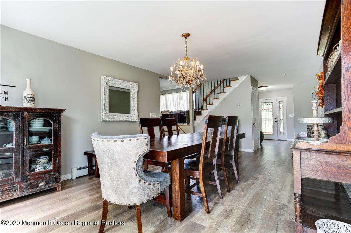 58 Ridge Road Branchville, NJ 07826 - Photo 8 of 51 a view of a dining room with furniture and wooden floor