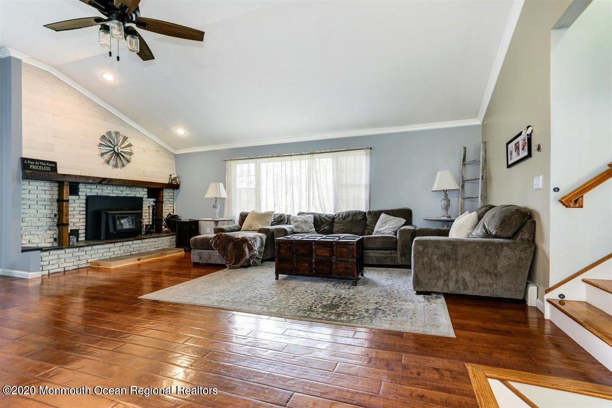 58 Ridge Road Branchville, NJ 07826 - Photo 9 of 51 a living room with furniture and a fireplace