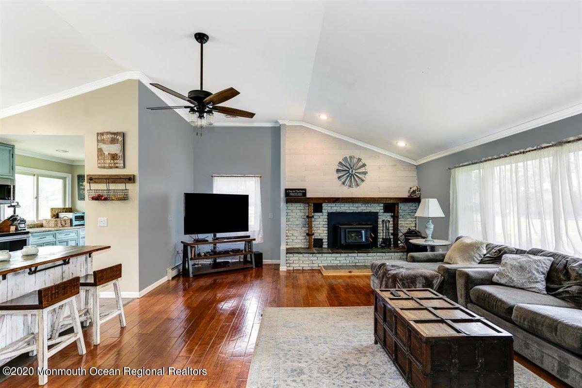 58 Ridge Road Branchville, NJ 07826 - Photo 10 of 51 a living room with fireplace furniture and a flat screen tv