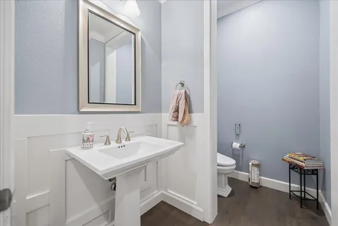 a view of a patio with a table and chairs and potted plants