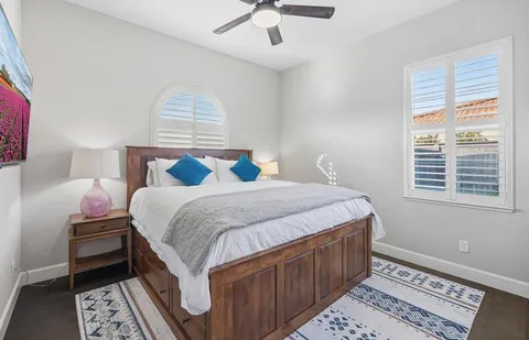a view of a patio with table and chairs